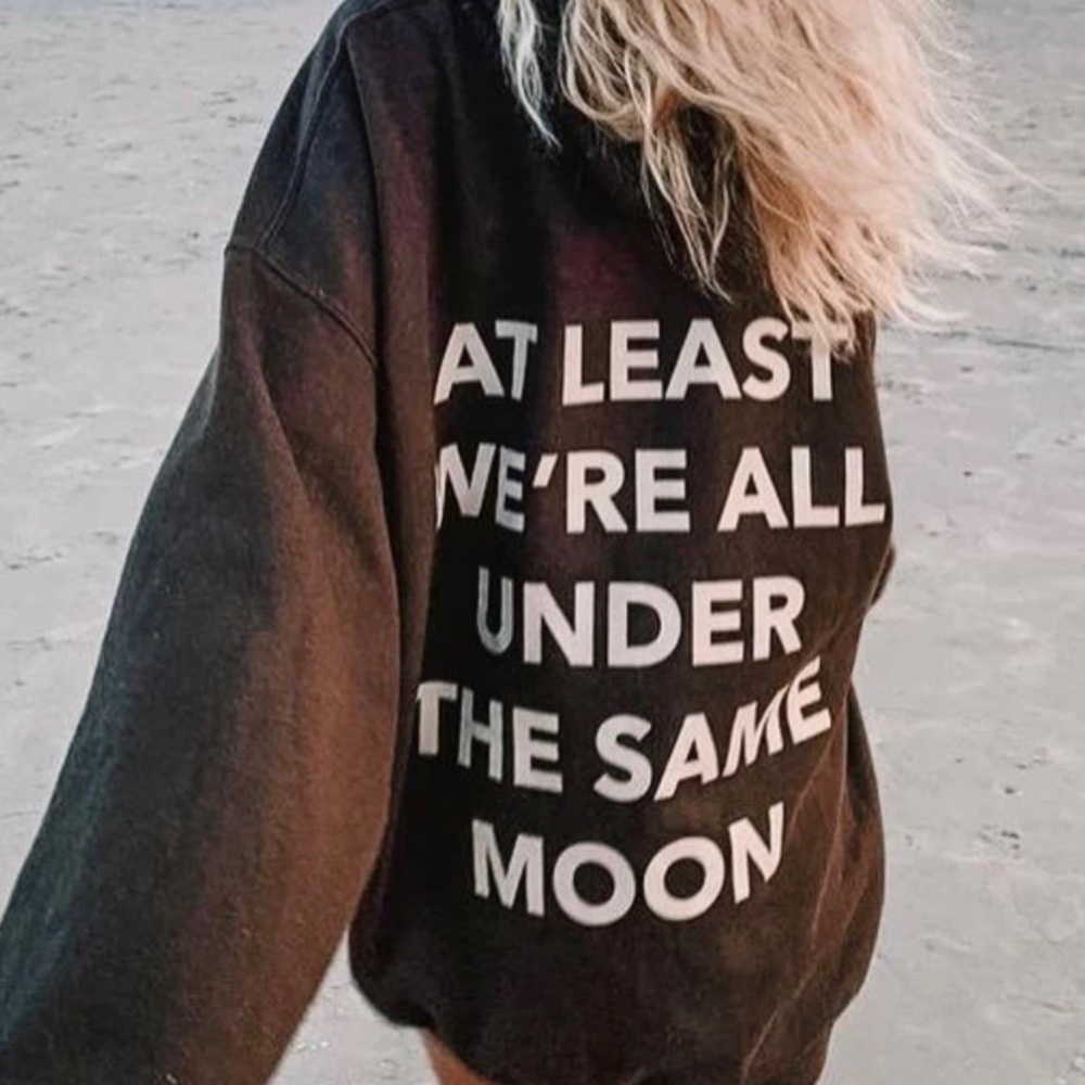 at least we’re all under the same moon crewneck L